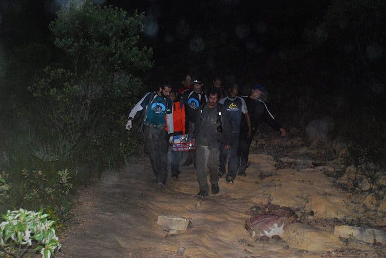 Firefighters surveying the scorched landscape of Vale do Capão, Chapada Diamantina