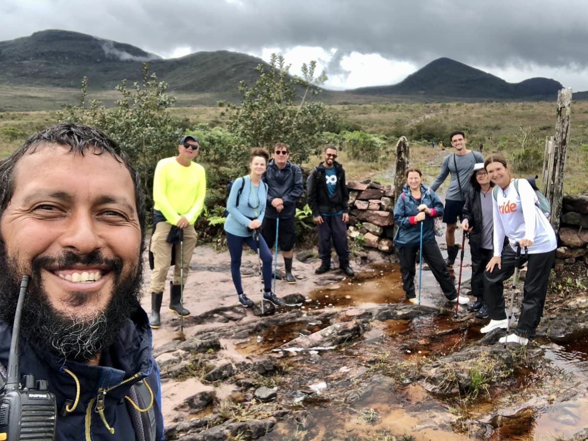 Trekkers making their way along a scenic path in Vale do Pati
