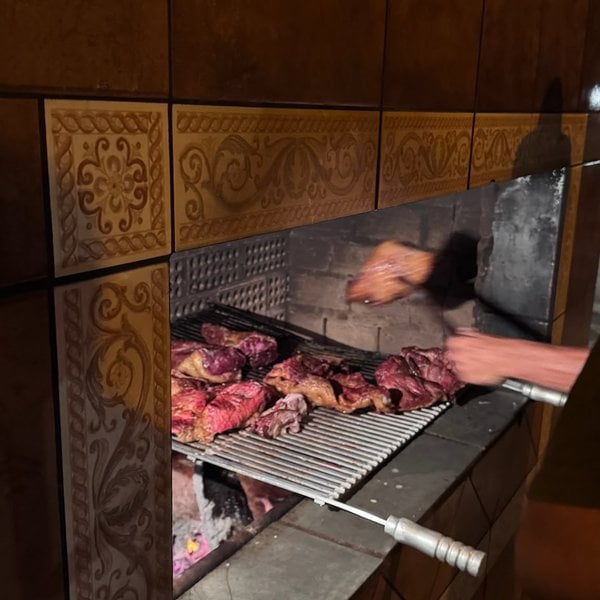 Cuts of meat grilling on the lodge barbecue