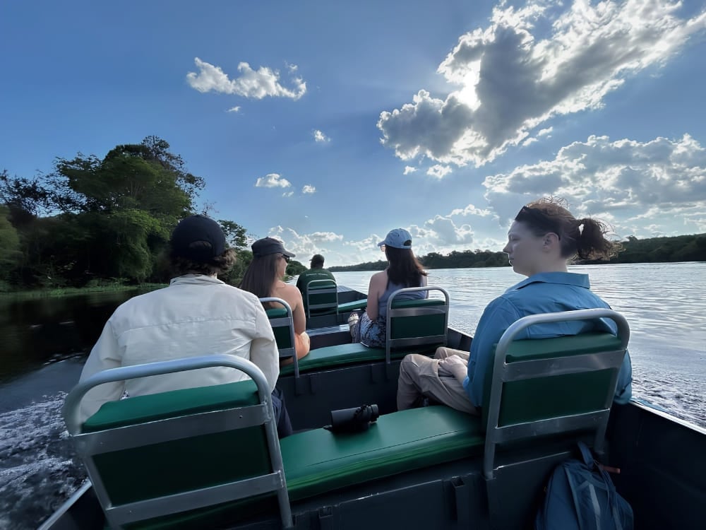 Travellers on a boat ride along the Rio Negro during a 3-day Amazon tour from Manaus