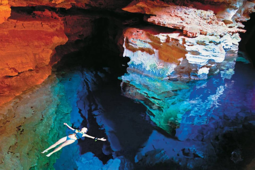 Floating in Poço Azul, embraced by the beauty of nature’s surroundings Poço Encantado and Poço Azul - what to do in Chapada Diamantina