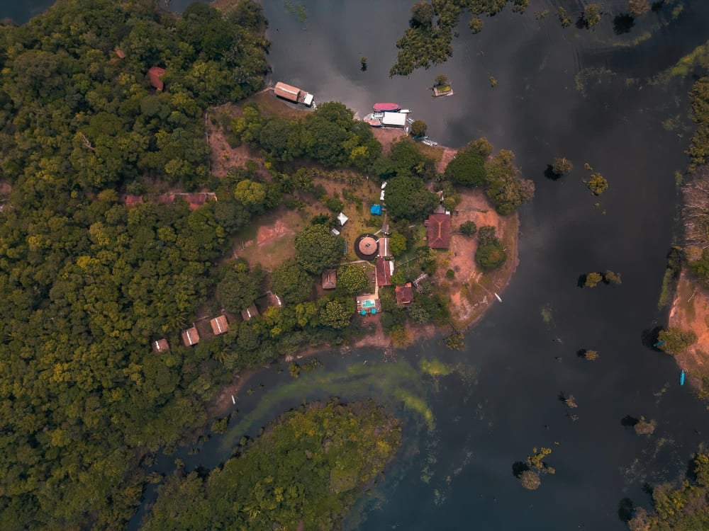. Aerial view of Amazon Turtle Lodge located by the river and deep inside the Brazilian Amazon rainforest.