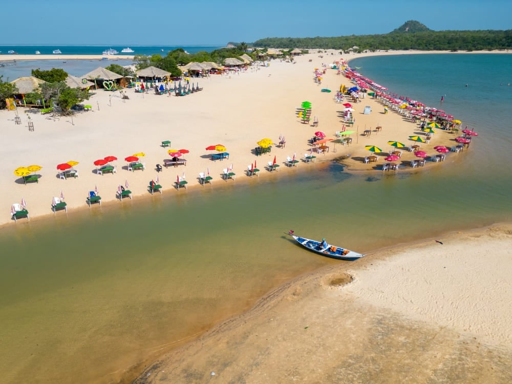 White sand beach of Ilha do Amor stretching into the clear waters of the Tapajós River in Alter do Chão. White sand beach of Ilha do Amor stretching into the clear waters of the Tapajós River in Alter do Chão.
