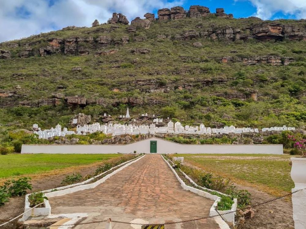 White tombstones of the Byzantine Cemetery built into a rocky mountain slope in Mucuge, Chapada Diamantina. White tombstones of the Byzantine Cemetery built into a rocky mountain slope in Mucuge, Chapada Diamantina.