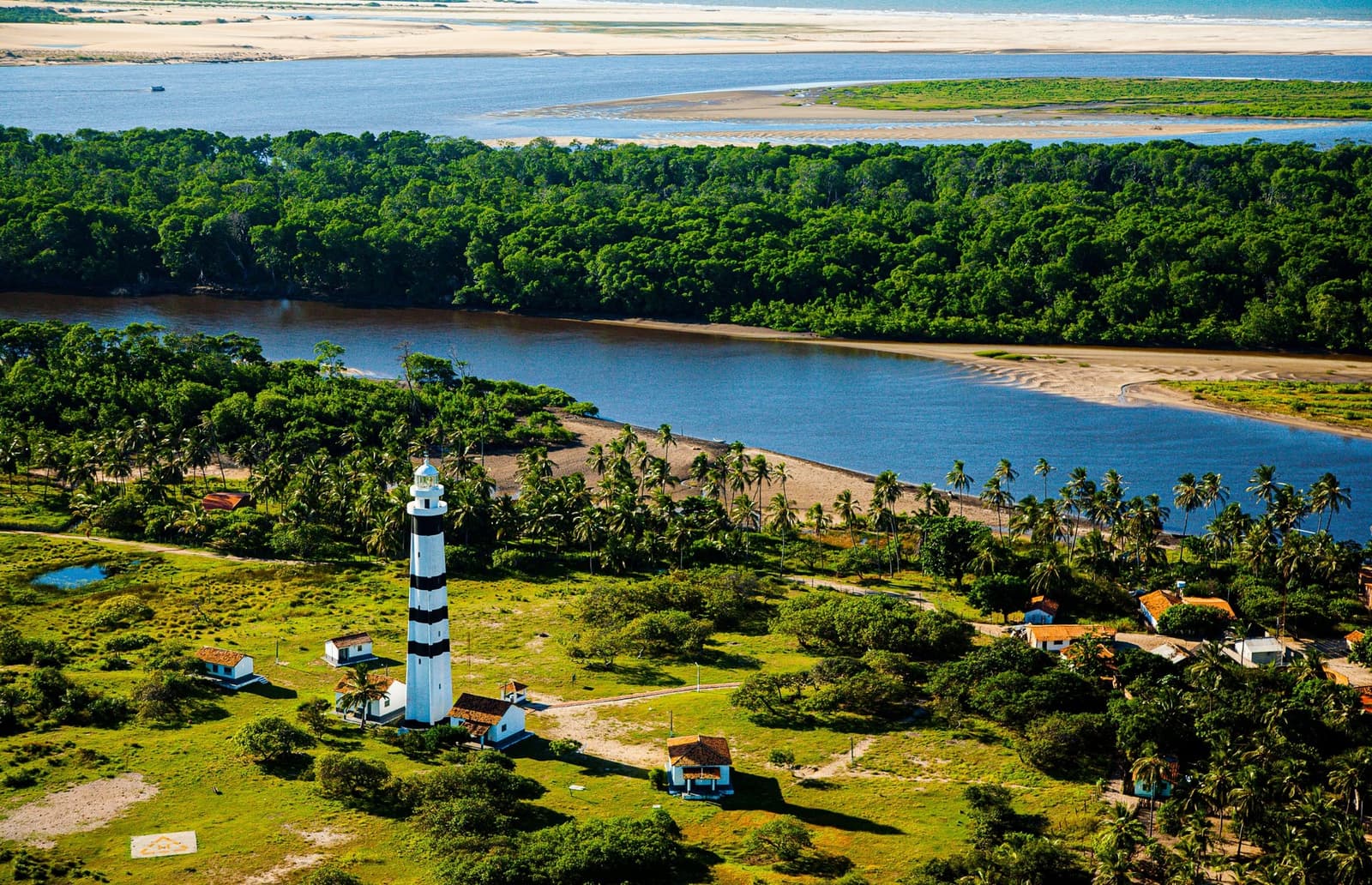 A lighthouse, a handful of houses, and the whole delta as a backyard. Photo 1
