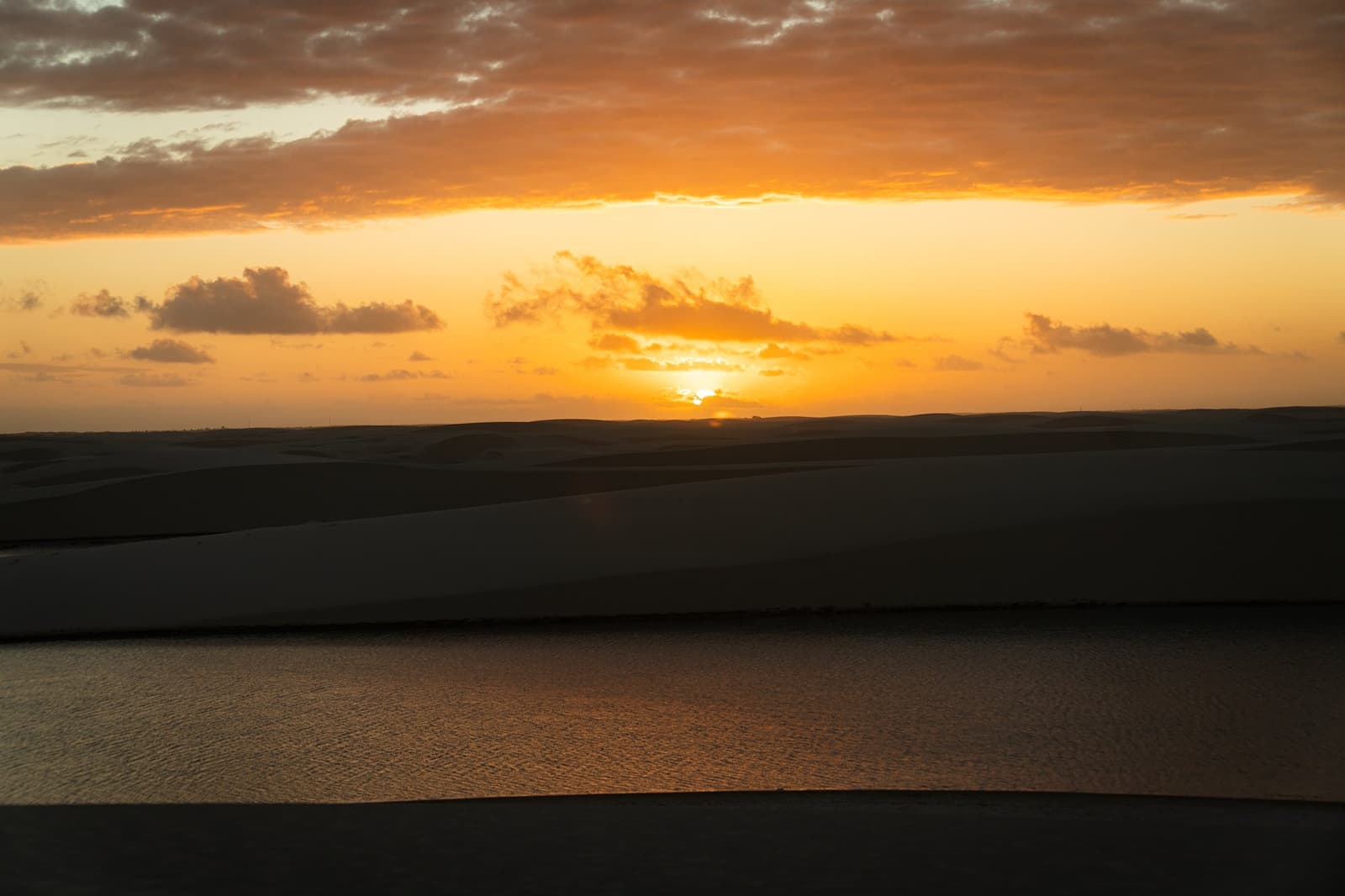 The sky goes all in at dusk, and the lagoon just mirrors it back. Photo 1