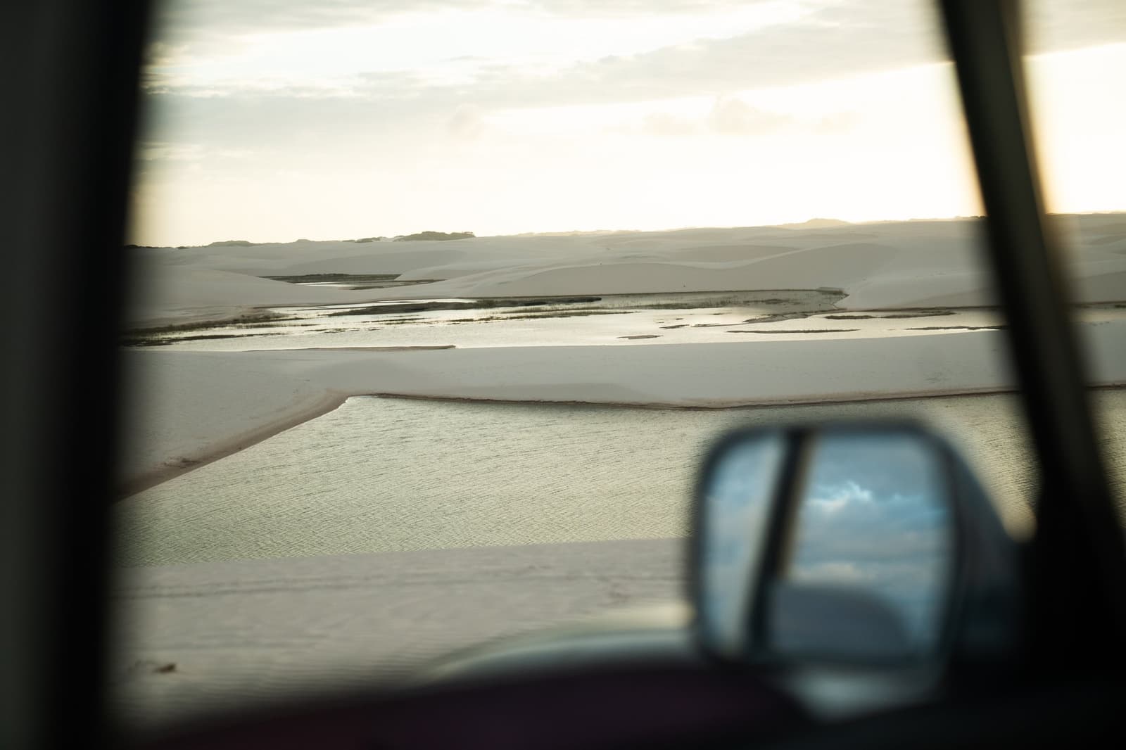 The dunes keep unfolding, and somehow the mirror makes it feel even bigger. Photo 2