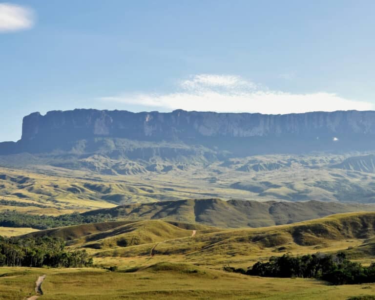 Mount Roraima's flat-topped tepui rising above the green Gran Sabana savanna in Venezuela