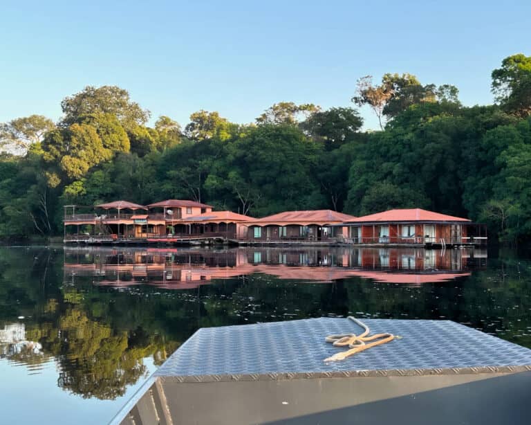 Amazon eco floating lodge on the Rio Negro seen from the boat at sunrise