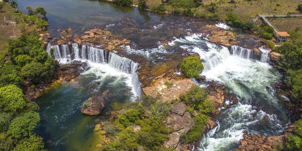 Aerial view of the wide Cachoeira da Velha waterfall cascading over rocks in the Jalapão ecosystem.