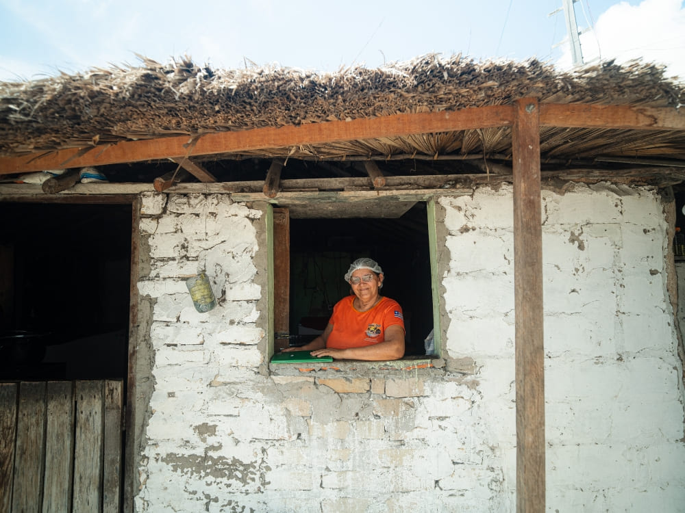 Dona Dete, posing for a photo in a house in Lençóis Maranhenses