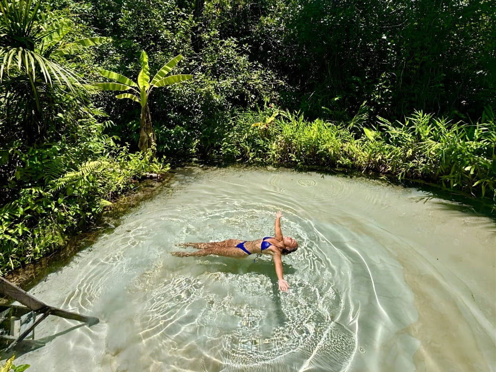 Samantha Sage floats peacefully on her back in the crystal-clear waters of the Jalapão, Brazil.